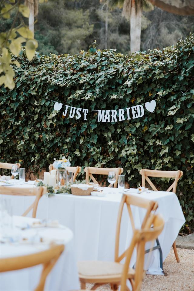'Just Married' sign above the tables