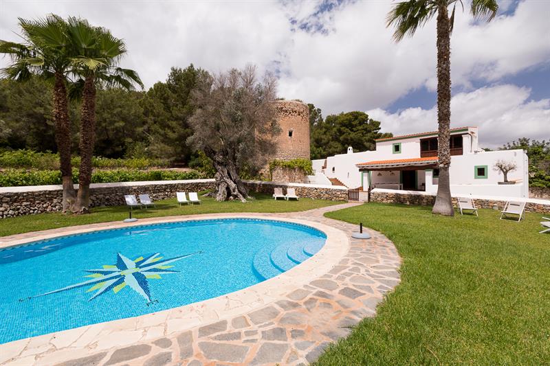 Pool and garden with the farmhouse and tower
