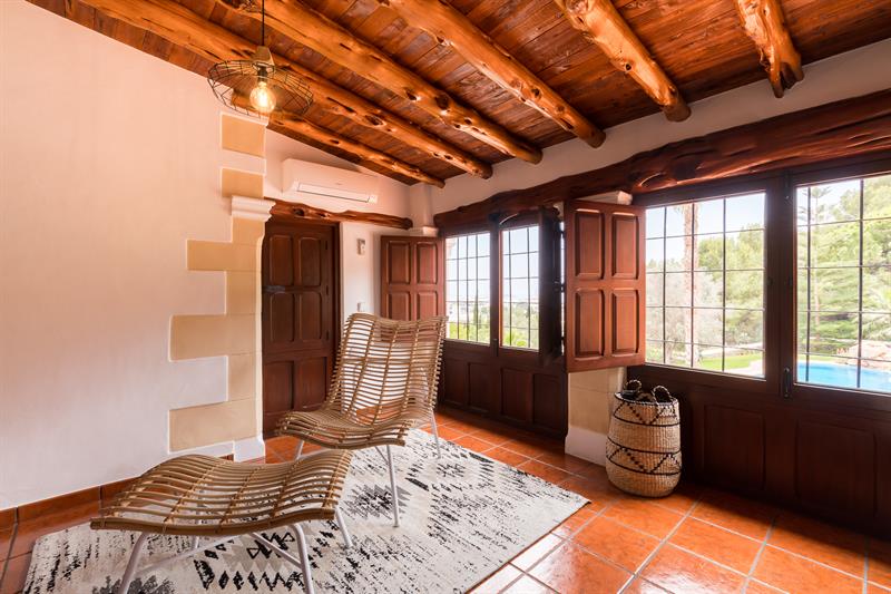 Master suite lounge chairs and terrace doors